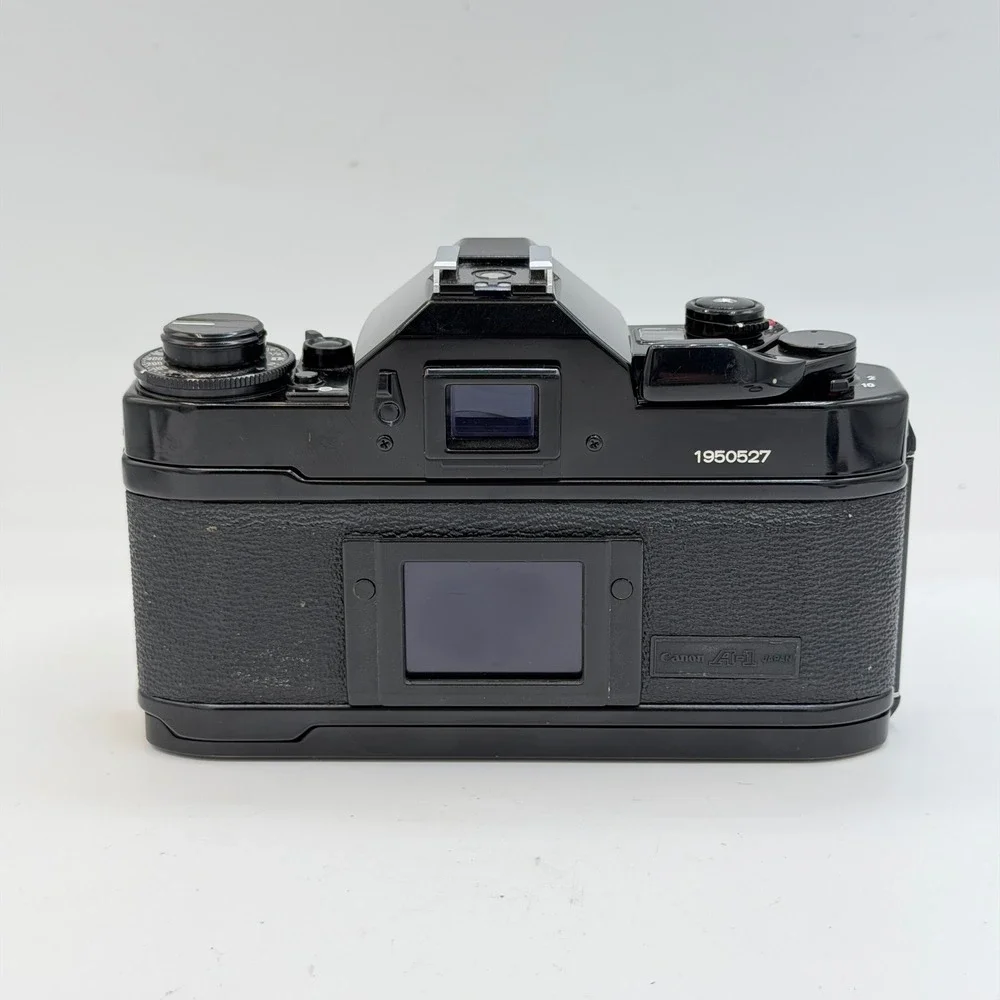 Canon A-1 35mm Film SLR Camera with FD 50mm 1:1.8 Lens, Filter, Cap Black TESTED